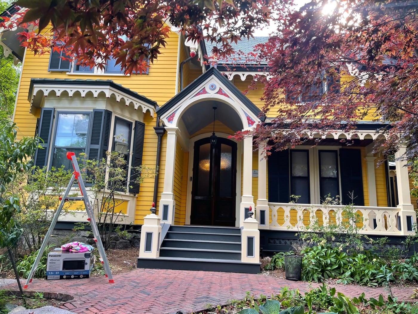 Colonial home exterior painting setup